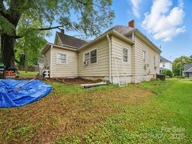 211 S Rowan Ave, Spencer, NC 28159 - view of property exterior with a chimney and cooling unit