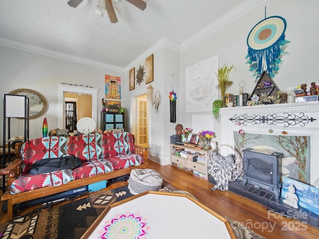 211 S Rowan Ave, Spencer, NC 28159 - living room with a wood stove, ceiling fan, ornamental molding, and wood finished floors
