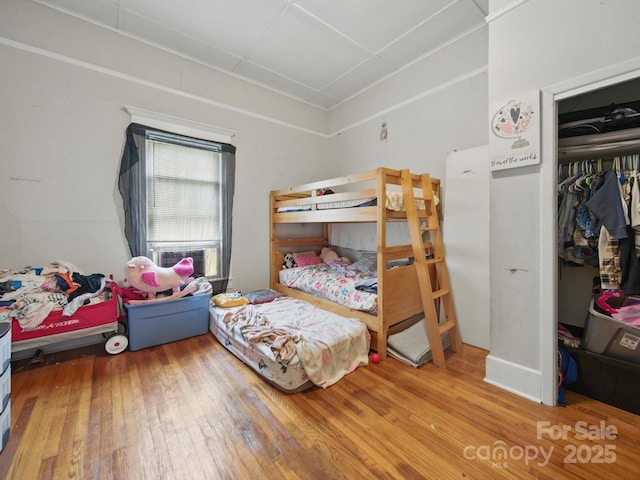 211 S Rowan Ave, Spencer, NC 28159 - bedroom featuring hardwood / wood-style flooring and a closet