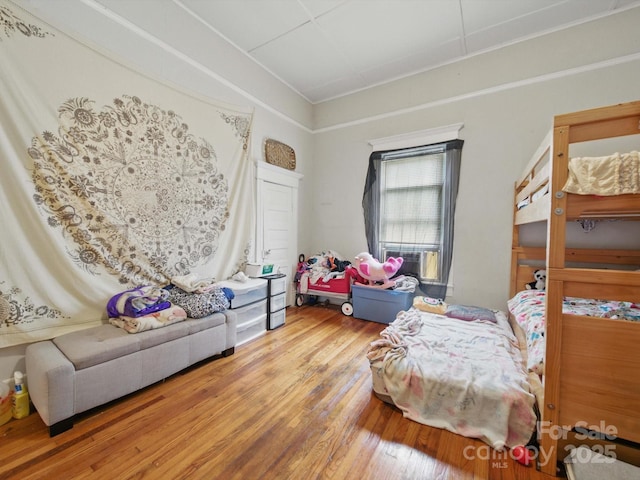 211 S Rowan Ave, Spencer, NC 28159 - bedroom featuring wood finished floors and cooling unit