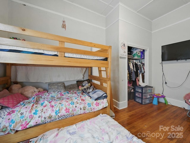 211 S Rowan Ave, Spencer, NC 28159 - bedroom with wood finished floors, a closet, and baseboards