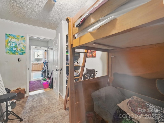 211 S Rowan Ave, Spencer, NC 28159 - carpeted bedroom featuring ornamental molding and a textured ceiling