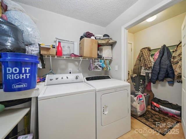 211 S Rowan Ave, Spencer, NC 28159 - laundry room with washer and dryer and a textured ceiling