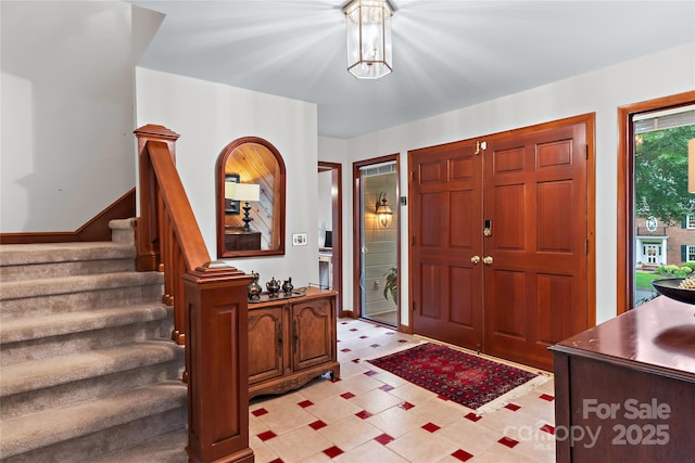 1201 Cliffspring Ct, Winston Salem, NC 27104 - entryway with light floors, stairs, and a chandelier