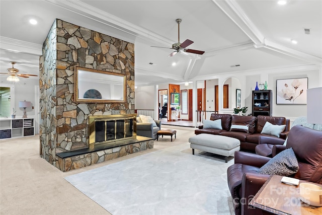 1201 Cliffspring Ct, Winston Salem, NC 27104 - carpeted living room featuring ceiling fan, ornamental molding, and a stone fireplace