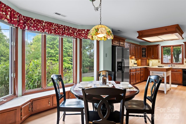 1201 Cliffspring Ct, Winston Salem, NC 27104 - dining room featuring plenty of natural light and light wood finished floors