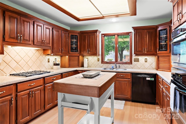 1201 Cliffspring Ct, Winston Salem, NC 27104 - kitchen with dishwasher, wall oven, a sink, light wood-type flooring, and oven