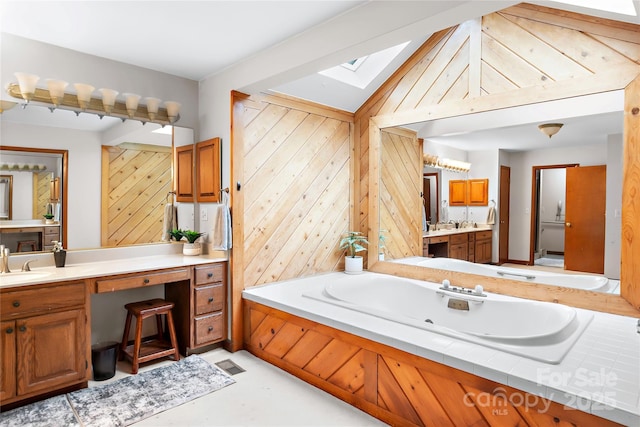 1201 Cliffspring Ct, Winston Salem, NC 27104 - full bath featuring a skylight, a tub with jets, vanity, and wood walls