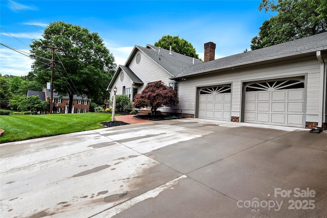 1201 Cliffspring Ct, Winston Salem, NC 27104 - view of side of home with driveway, a chimney, a lawn, and an attached garage