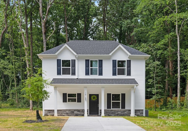 1815 Wildwood Dr, Charlotte, NC 28214 - view of front of house featuring a porch, stone siding, and roof with shingles