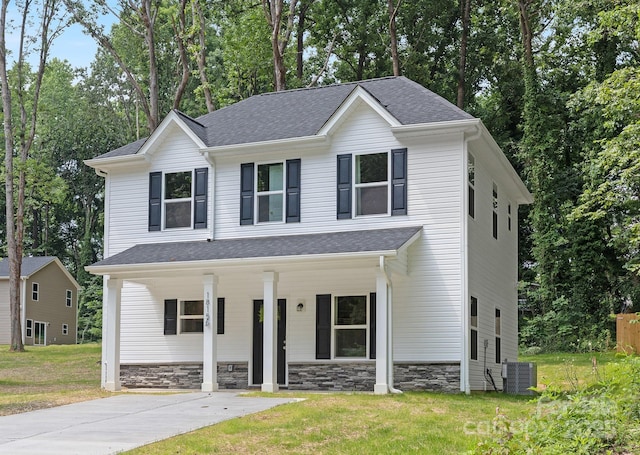 1815 Wildwood Dr, Charlotte, NC 28214 - view of front of property with covered porch, central AC, a front yard, stone siding, and a shingled roof