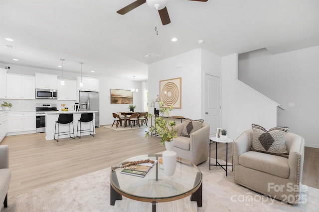 1815 Wildwood Dr, Charlotte, NC 28214 - living area featuring light wood-style flooring, a ceiling fan, recessed lighting, and baseboards