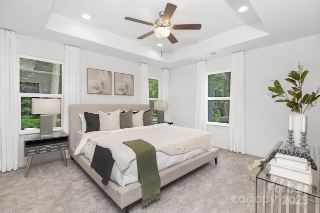 1815 Wildwood Dr, Charlotte, NC 28214 - bedroom featuring a tray ceiling, light colored carpet, recessed lighting, ceiling fan, and baseboards