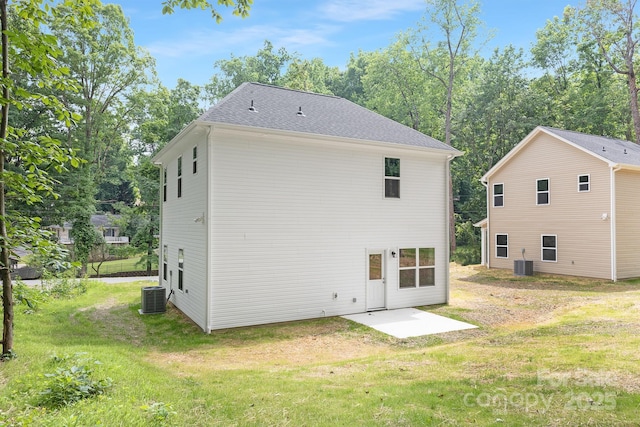 1815 Wildwood Dr, Charlotte, NC 28214 - back of house featuring a patio area, central air condition unit, and a lawn