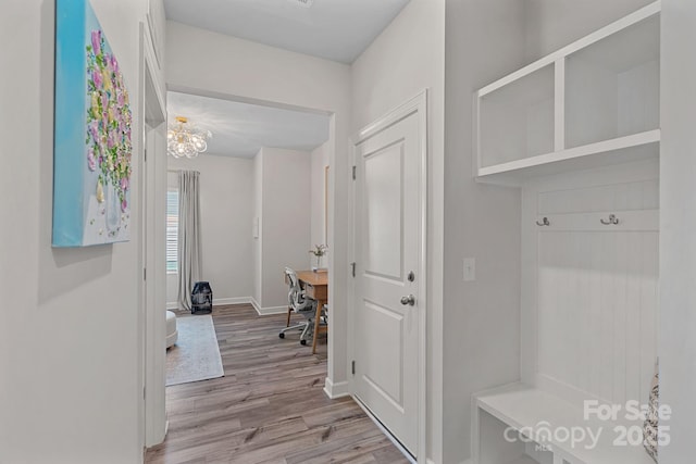 1344 Sweet Pea St, Monroe, NC 28110 - mudroom with wood finished floors, baseboards, and a chandelier