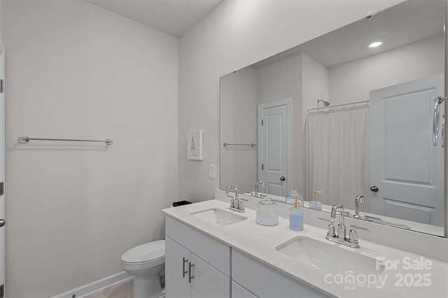 1344 Sweet Pea St, Monroe, NC 28110 - full bathroom with double vanity, toilet, baseboards, recessed lighting, and curtained shower