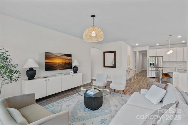 1344 Sweet Pea St, Monroe, NC 28110 - living area featuring recessed lighting, light wood-style floors, and baseboards