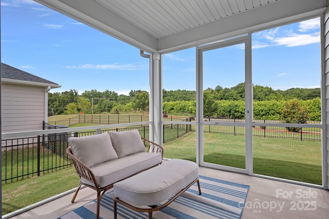 1344 Sweet Pea St, Monroe, NC 28110 - sunroom / solarium featuring an outdoor hangout area, view of scattered trees, and healthy amount of natural light