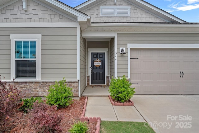1344 Sweet Pea St, Monroe, NC 28110 - entrance to property featuring stone siding, driveway, and an attached garage