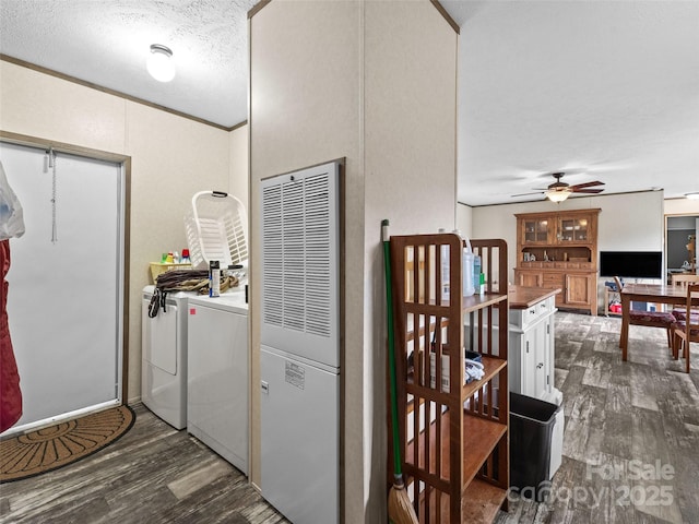 38 Kemp Rd, Pisgah Forest, NC 28768 - washroom featuring washing machine and dryer, a heating unit, dark wood finished floors, a ceiling fan, and a textured ceiling