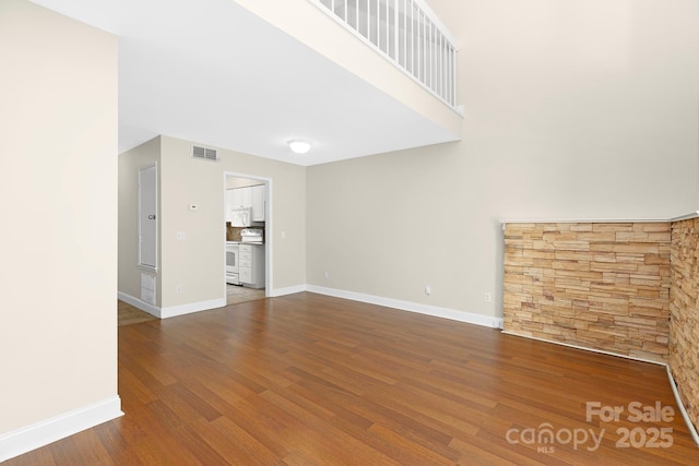 6101 Heath Ridge Ct, Charlotte, NC 28210 - unfurnished living room featuring wood finished floors and baseboards