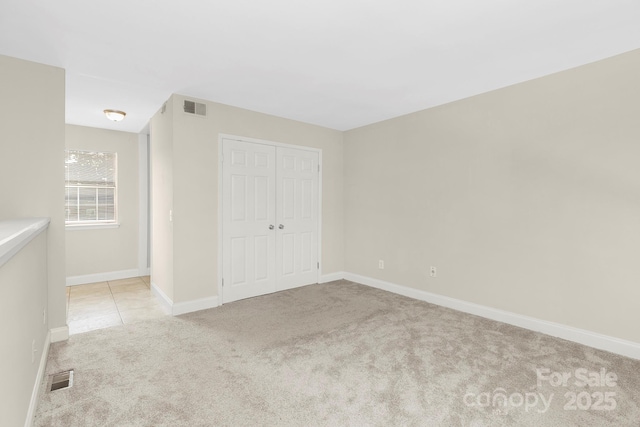 6101 Heath Ridge Ct, Charlotte, NC 28210 - unfurnished bedroom with light colored carpet, a closet, and baseboards