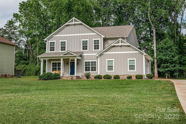 360 Sundown Rd, Mooresville, NC 28117 - view of front of house with board and batten siding, roof with shingles, a front yard, and concrete driveway