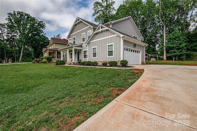 360 Sundown Rd, Mooresville, NC 28117 - craftsman house with board and batten siding, a porch, driveway, a front yard, and a garage