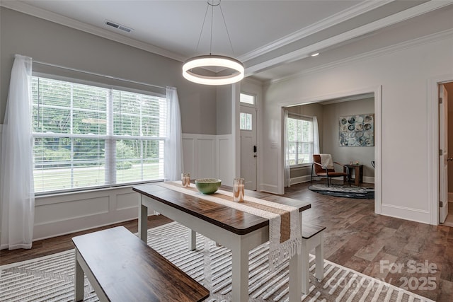 360 Sundown Rd, Mooresville, NC 28117 - dining area with wood finished floors, ornamental molding, a decorative wall, and a wainscoted wall