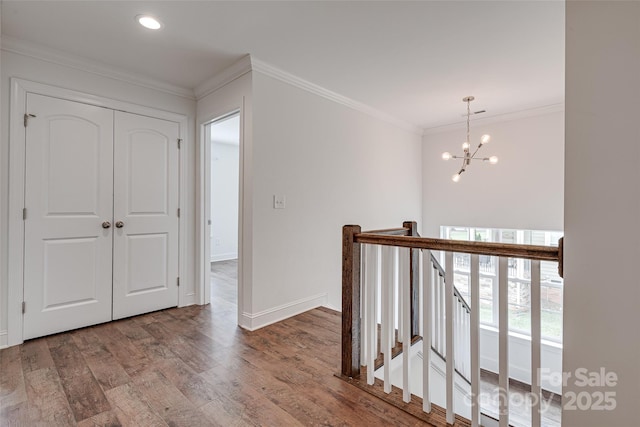 360 Sundown Rd, Mooresville, NC 28117 - corridor with an upstairs landing, crown molding, wood finished floors, baseboards, and a chandelier