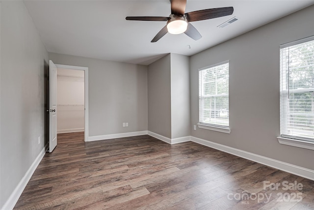 360 Sundown Rd, Mooresville, NC 28117 - empty room with dark wood-style floors, ceiling fan, and baseboards