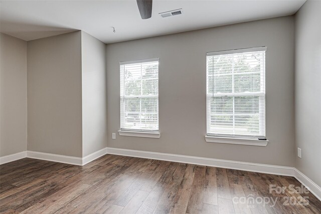 360 Sundown Rd, Mooresville, NC 28117 - empty room with baseboards, dark wood-type flooring, and ceiling fan