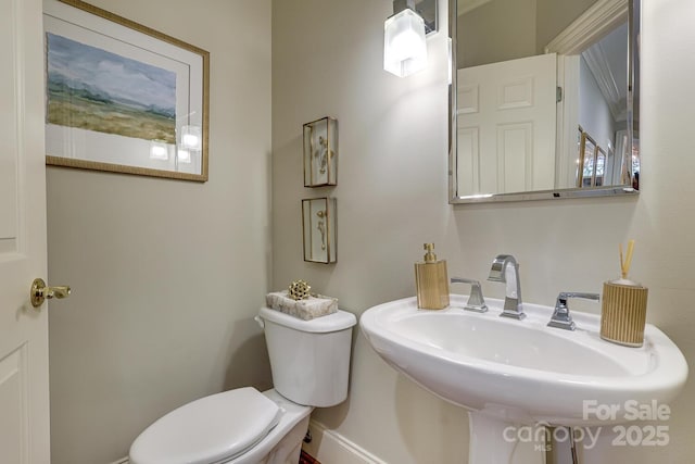 525 Queens Rd, Charlotte, NC 28207 - half bathroom with toilet, a sink, and baseboards