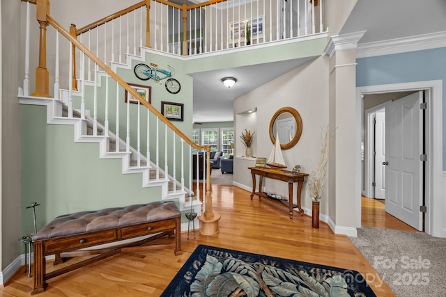 10703 Back Ridge Rd, Charlotte, NC 28277 - entryway with stairs, wood finished floors, baseboards, a high ceiling, and ornamental molding