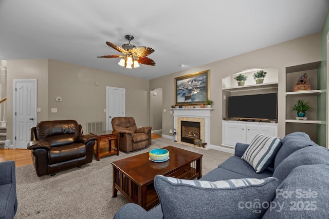 10703 Back Ridge Rd, Charlotte, NC 28277 - living area with a ceiling fan, a fireplace, carpet flooring, stairs, and built in features