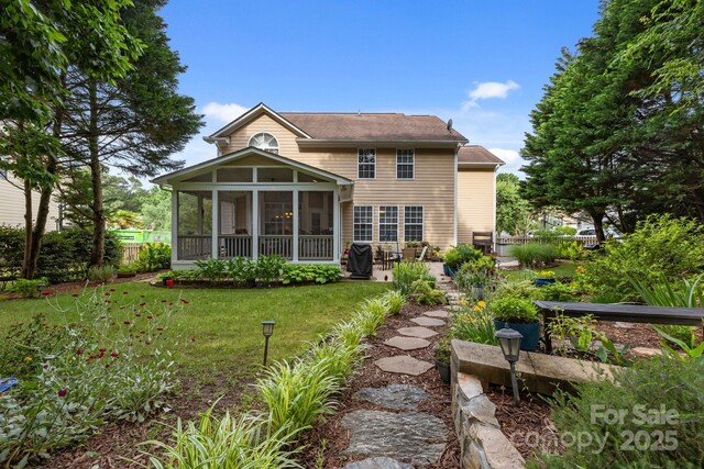 10703 Back Ridge Rd, Charlotte, NC 28277 - rear view of property with a sunroom, a lawn, and a patio