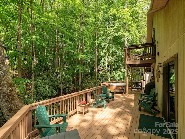 141 Creekside Dr, Maggie Valley, NC 28751 - wooden deck with a hot tub and a view of trees