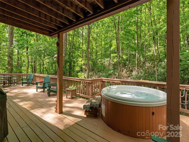 141 Creekside Dr, Maggie Valley, NC 28751 - deck with a hot tub and a wooded view