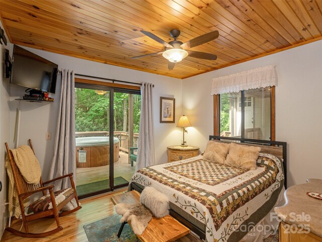 141 Creekside Dr, Maggie Valley, NC 28751 - bedroom with access to exterior, multiple windows, light wood finished floors, wood ceiling, and ceiling fan
