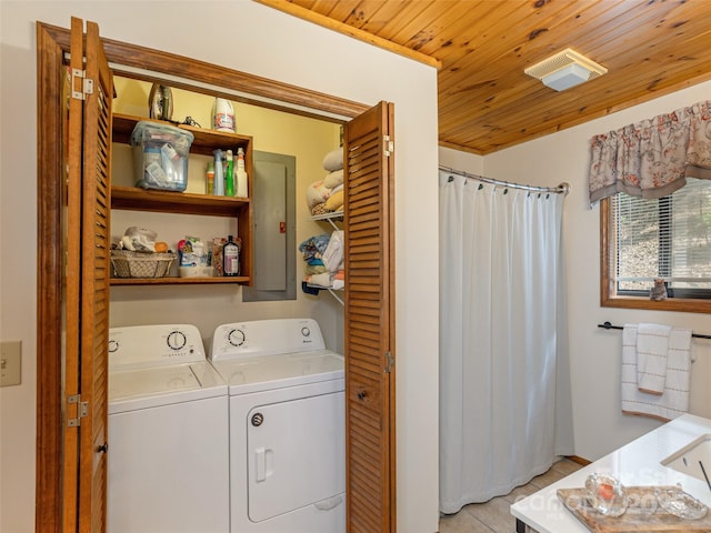 141 Creekside Dr, Maggie Valley, NC 28751 - laundry area with washing machine and clothes dryer, wood ceiling, and light tile patterned floors