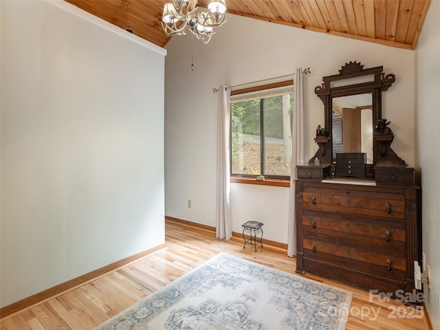 141 Creekside Dr, Maggie Valley, NC 28751 - bedroom featuring vaulted ceiling, wooden ceiling, a chandelier, light wood-type flooring, and baseboards