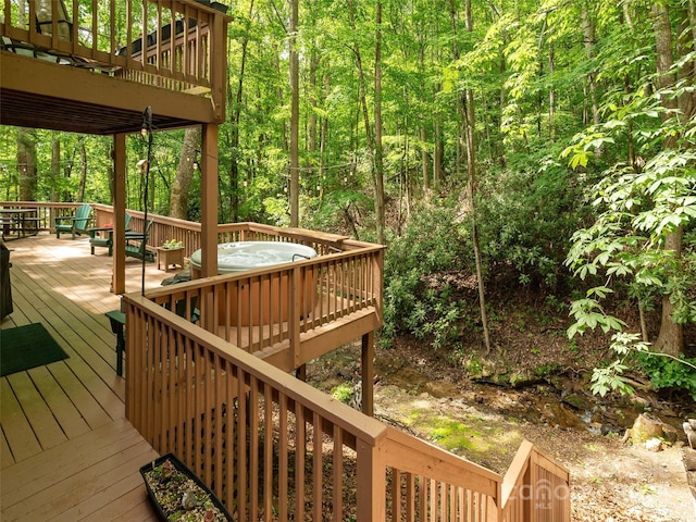 141 Creekside Dr, Maggie Valley, NC 28751 - deck with a hot tub and a view of trees
