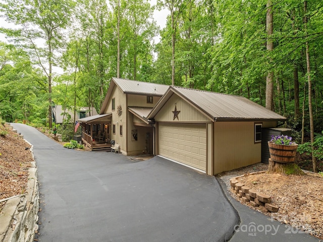 141 Creekside Dr, Maggie Valley, NC 28751 - view of front of property featuring metal roof and a garage