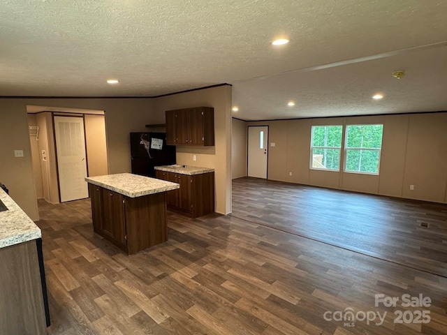 3162 Bear Trail Dr, Lenoir, NC 28645 - kitchen featuring freestanding refrigerator, light countertops, a textured ceiling, dark wood-style floors, and recessed lighting