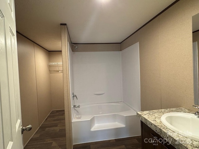 3162 Bear Trail Dr, Lenoir, NC 28645 - bathroom featuring wood finished floors, vanity, ornamental molding, shower / bath combination, and a decorative wall