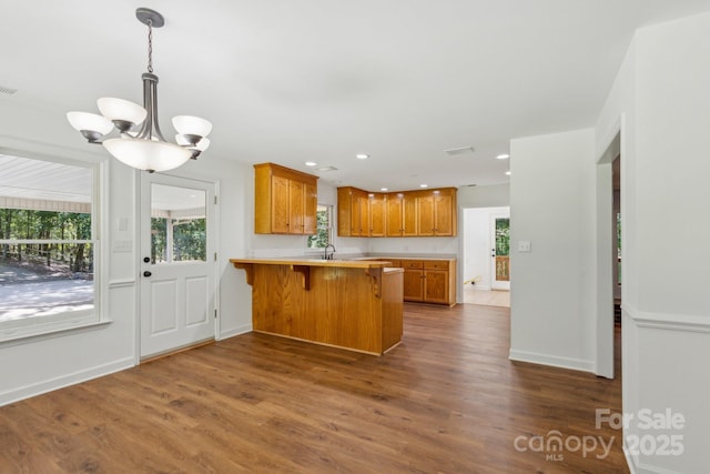 3090 Goblet Rd, Richburg, SC 29729 - kitchen featuring a peninsula, a chandelier, healthy amount of natural light, dark wood-style floors, and recessed lighting