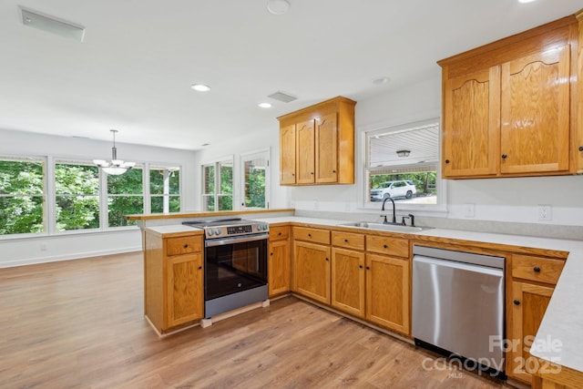3090 Goblet Rd, Richburg, SC 29729 - kitchen with stainless steel appliances, a sink, a peninsula, light countertops, and recessed lighting