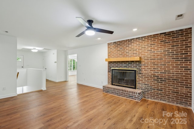 3090 Goblet Rd, Richburg, SC 29729 - unfurnished living room featuring ceiling fan, wood finished floors, baseboards, recessed lighting, and brick wall
