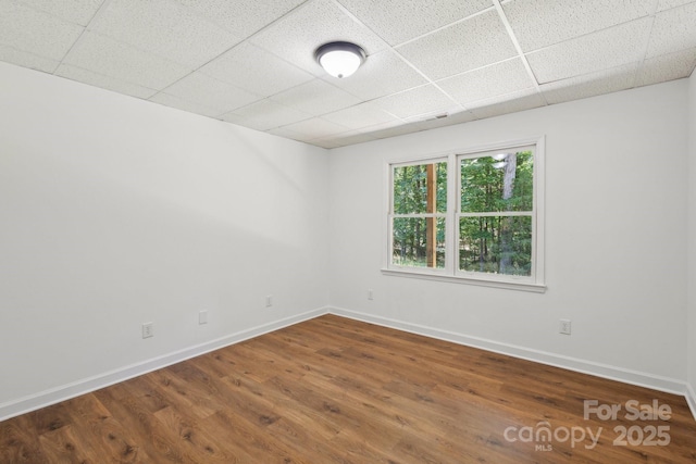 3090 Goblet Rd, Richburg, SC 29729 - unfurnished room featuring a drop ceiling, baseboards, and wood finished floors