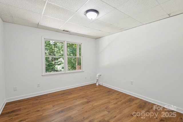 3090 Goblet Rd, Richburg, SC 29729 - unfurnished room featuring a paneled ceiling, wood finished floors, and baseboards